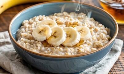 Oatmeal breakfast bowl with banana slices and honey drizzle food still life