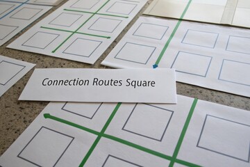 Flat lay of connection routes square game grids with green connecting lines