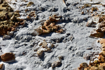 Toxic gold mining residual waters from gold mine flowing and polluting environment