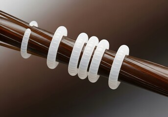 Macro medical photo of hair casts (pseudonits) on a single hair shaft. White tubular structures encircling the strand, often confused with head lice nits. Dermatology and trichology concept.