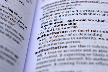 Fototapeta premium Close Up Of English Dictionary Page With Word - authoritarian
