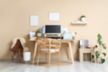 Stylish workplace with modern computer in office. Blurred view