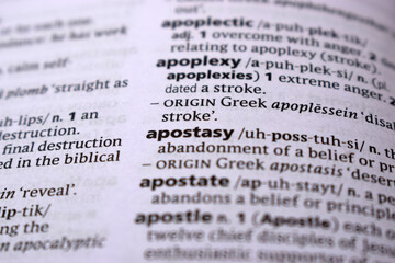 Fototapeta premium Close Up Of English Dictionary Page With Word - apostasy