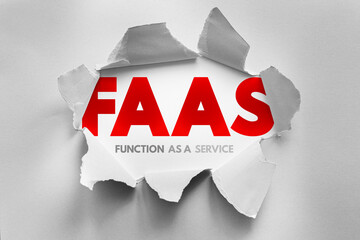 Bold FAAS letters burst through torn paper with the words Function As A Service underneath. Conceptual cloud computing term highlighting serverless architecture and scalable app deployment