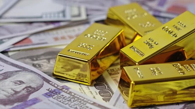 100 dollar bills with gold bars. Wealth saving concept