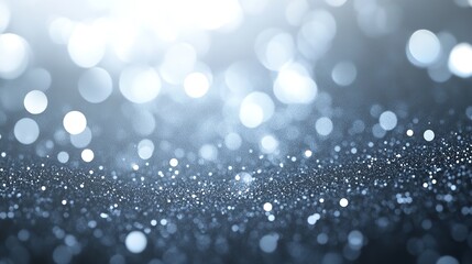 Blue glitter sparkles and shines, creating a festive and elegant background with a beautiful bokeh effect