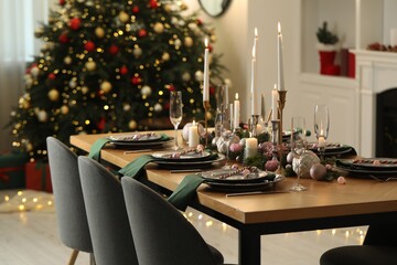 Festive table setting with Christmas decor at home