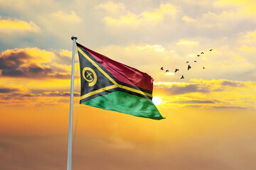 Vanuatu flag waving in sunset or sunrise. Vanuatu flag for Republic Day and Independence Day.