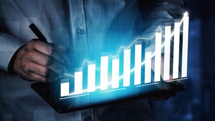A business professional engages with growth data on a tablet, highlighting a dynamic graph...