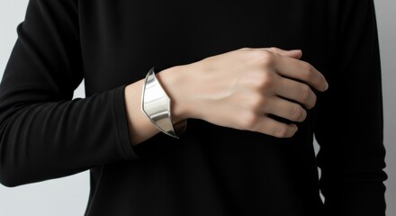 hands wearing minimalist silver cuff bracelets ,Close-Up Modern Jewelry Photography Against Light Background 