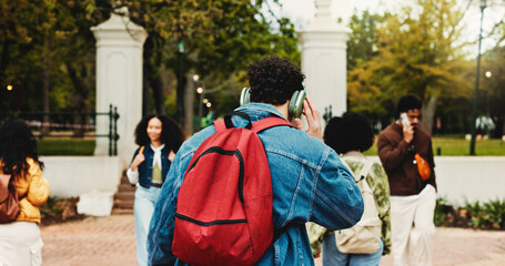 Man, students and back with headphones at college, bag and education with streaming, scholarship or study. Person, audio and listen to music, learning and subscription at university campus for course