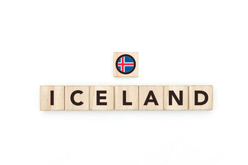Wooden blocks bearing the name and flag of Iceland. Icelander and Nordic Culture, national identity, travel, and geography in a copy space design.