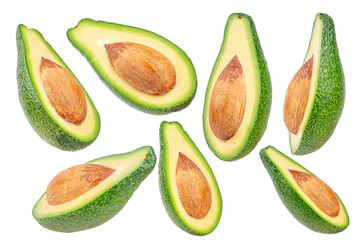set of fresh avocado halves with pits isolated, green tropical fruit rich in healthy fats and vitamins, organic food concept advertising or banner