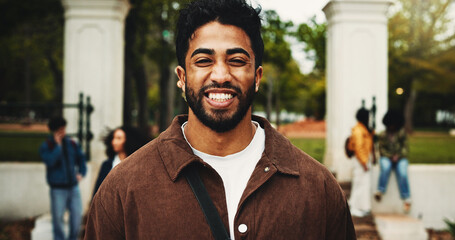 Portrait, happy man and student on campus with college scholarship, education and skill development. Proud, person outdoor and smile at university for knowledge, academic goals and study opportunity.