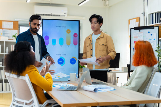 Group of Multiracial creative business brain storm meeting presentation,discussing roadmap to product launch, planning,strategy,new business development,working with new startup project in office.