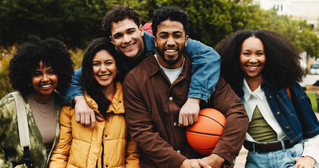 Portrait, friends or university student with hug on campus, education support or outdoor bonding on study break. Embrace, diversity and happy people learn together, care and knowledge with basketball