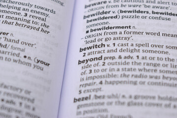 Fototapeta premium Close Up Of English Dictionary Page With Word - bewitch