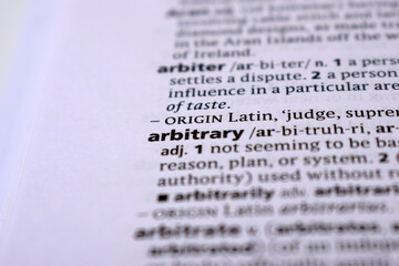 Close Up Of English Dictionary Page With Word - arbitrary