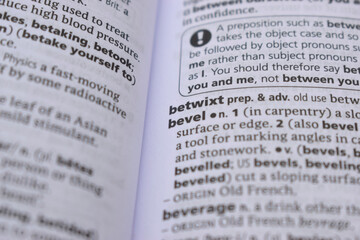 Fototapeta premium English Definition Dictionary Page Close Up Of Printed Word Of -betwixt