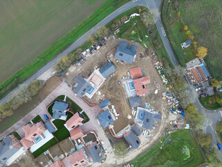 Drone view of a part completed new housing development site in rural Essex, UK. Both affordable and luxury family homes are on the Greenfield site.