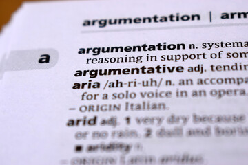 Close Up Of English Dictionary Page With Word - arigumentation