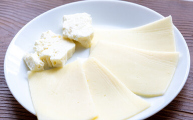 Close-Up of European Cheeses on Plate
