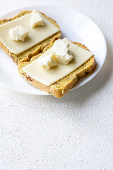 Close-Up of European Cheeses on Bread