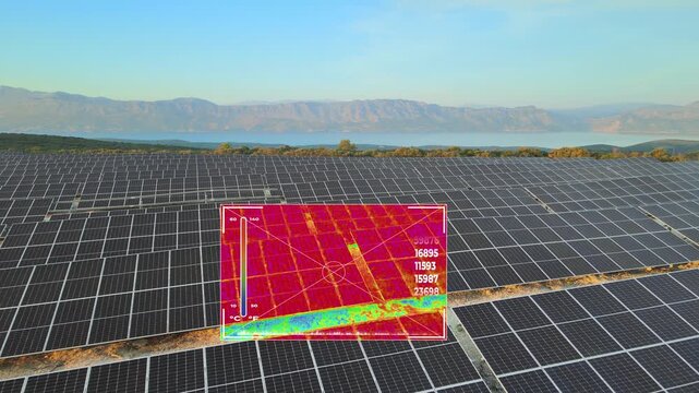 Drone with infrared thermal camera inspecting malfunction and efficiency of solar panels. Aerial