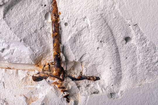 Rusty Rebar in Concrete Wall