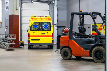Ambulance vehicle positioned inside the venue, prepared for emergency response during the event