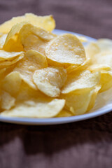 Close-Up of Potato Chips on a Brown Surface