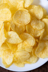 Close-Up of Potato Chips on a Brown Surface
