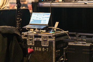 Sound and lighting engineers equipment set up in a concert venue before the show, ready for managing audio and visual effects during the performance