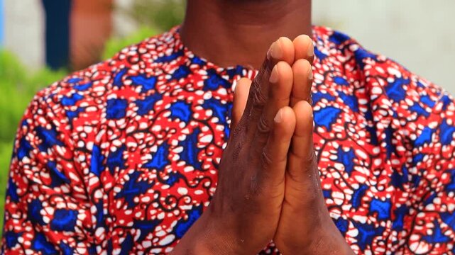 Close-up of hands in prayer gesture