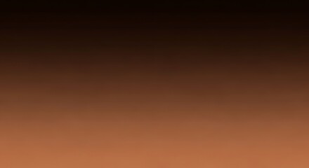 Subtle chromatic gradient of a blurry brown monochrome background