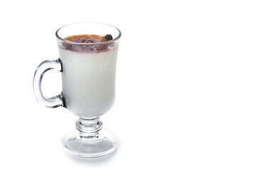 Eggnog with Cinnamon in glass isolated on white background. Christmas drink. Copy space