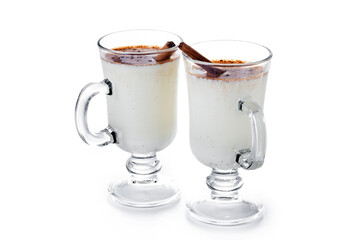 Eggnog with Cinnamon in glass isolated on white background. Christmas drink