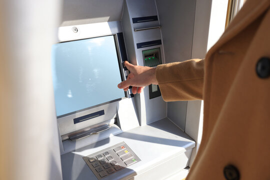 Man using modern cash machine, closeup. ATM