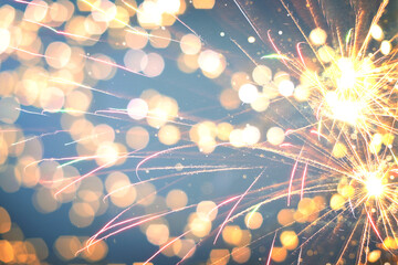 Christmas background with fireworks and bokeh lights. Festive wallpaper or greeting card