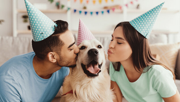 A couple wearing party hats shares a joyful moment with their golden retriever in a cozy living room setting. They show affection while enjoying a festive atmosphere together. - Powered by Adobe
