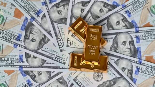 hundred dollar bills with gold bars