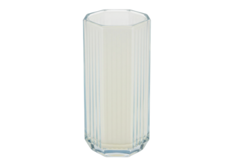 Isolated octagonal glass of liquid, a refreshing dairy drink product on a light surface