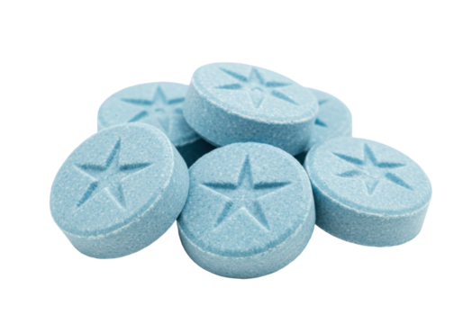 Isolated light blue pills with a star design, medication for pain relief and treatment