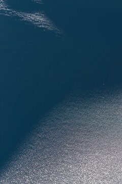 Subtle reflection over deep blue frozen snow field