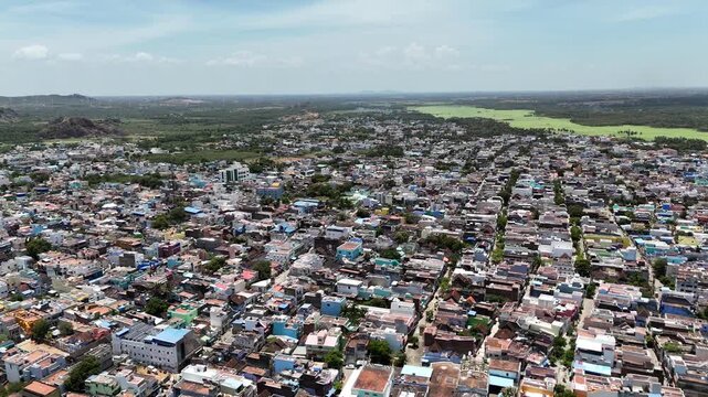 The aerial view of Indian hill station, blending community life with natural beauty. It illustrates the harmonious coexistence of a thriving community with the natural beauty of the Western Ghats