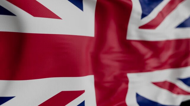Loop. Close-up of the Union Jack flag with visible fabric texture. A symbol of British identity, heritage, and international representation.