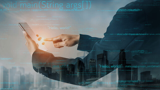 A business professional interacts with a digital tablet featuring coding visuals against a city skyline. This image captures the essence of innovation and technology in urban settings. Xenic