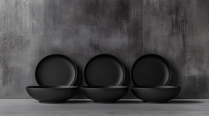 Elegant Black Dishware on Cement Surface