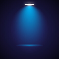 Blue spotlight illuminating a stage with soft light beam effect and reflection
