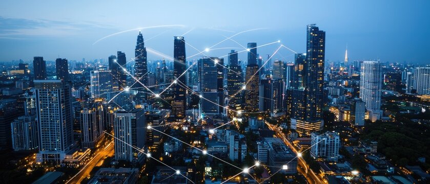 Digital city skyline illuminated at night showcasing smart urban technology and glowing connections between skyscrapers - Powered by Adobe